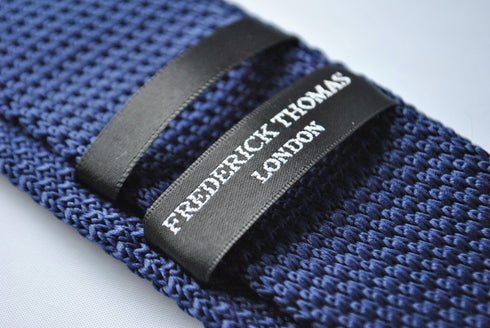 knitted navy blue tie with light blue polka dots